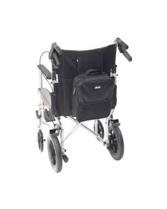 A small black sqaure bag attached to the rear of a wheelchair