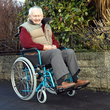 The old man sitting in a lightweight aluminium self propelled wheelchair