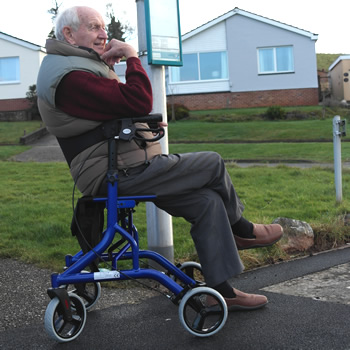 A man sitting on a wheelchair for hire